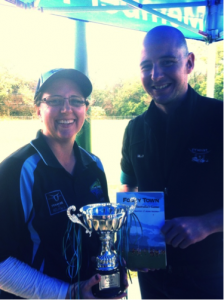 Gap Dragons President Donna Telfer and club sponsor Bill from Meat @ Billy’s with The Billy’s Cup and a copy of Footy Town